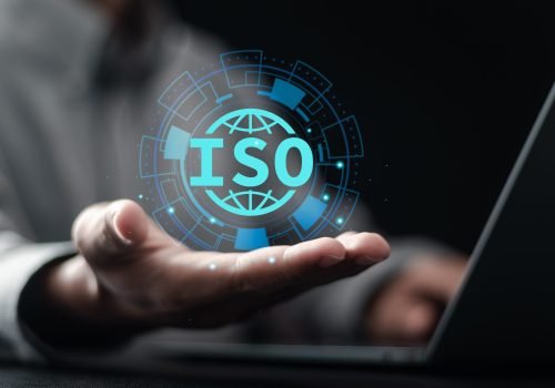 ISO quality control assurance standards business concept. Businessman use laptop and show ISO and globe icons on virtual screen. business standard auditing quality control certification.